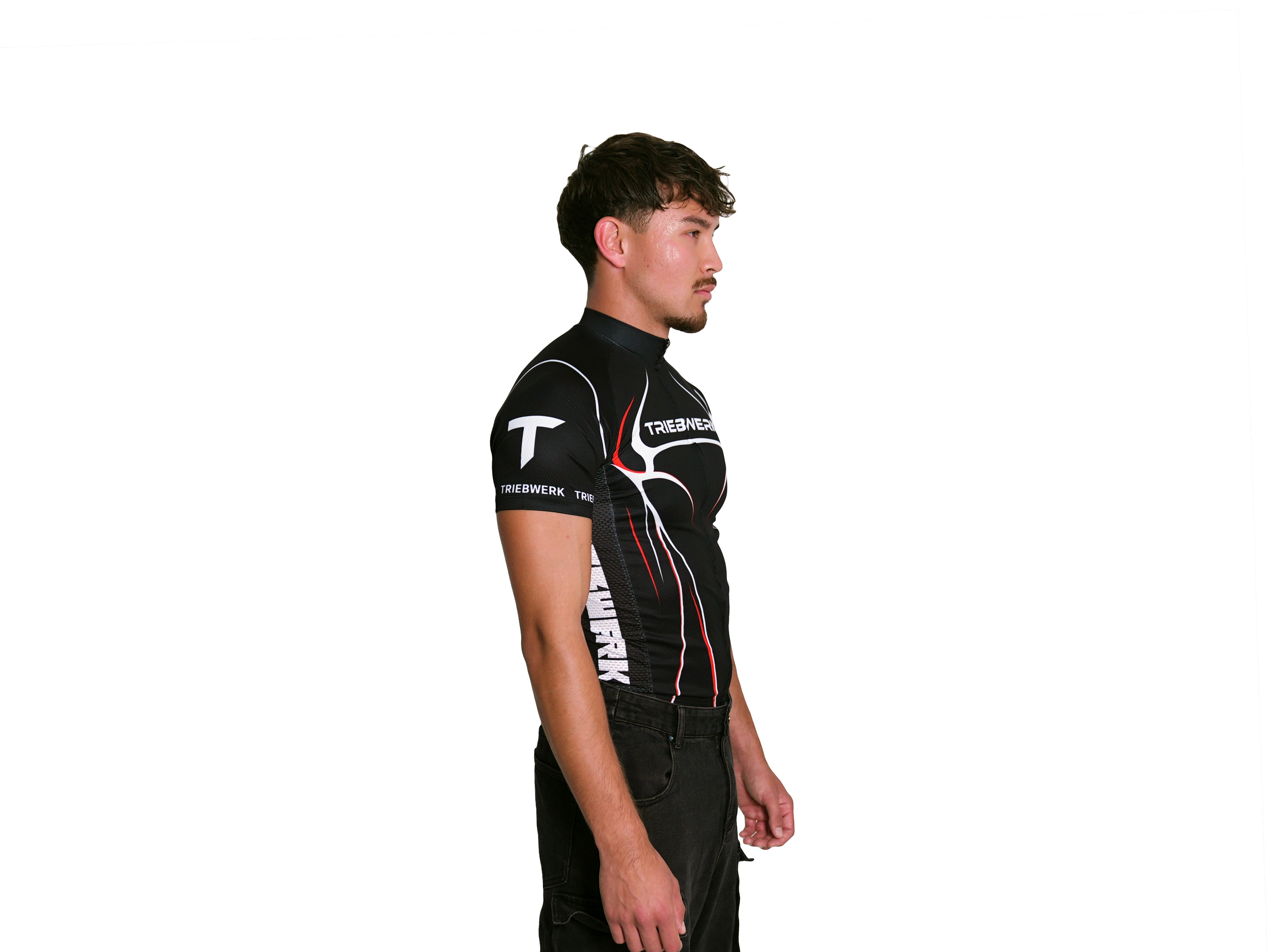 Person wearing a black and red sports outfit with visible branding on a white background